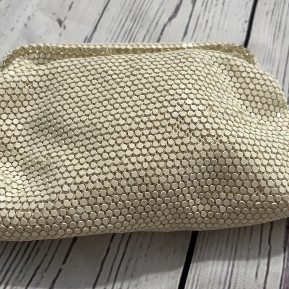 Dainty special occasion clutch with snap hinge closure cream